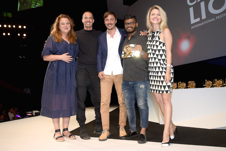 Y&R Dubai ECD, Kalpesh Patankar, with his team on stage for 'One Book For Peace' Gold win 